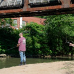 fishing under rail bridge